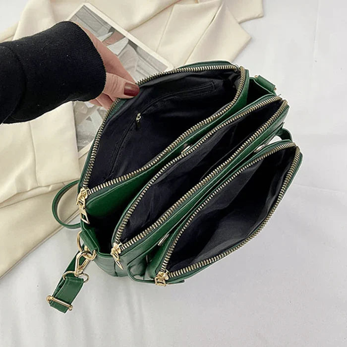 Damska torebka crossbody z kieszeniami i regulowanym paskiem